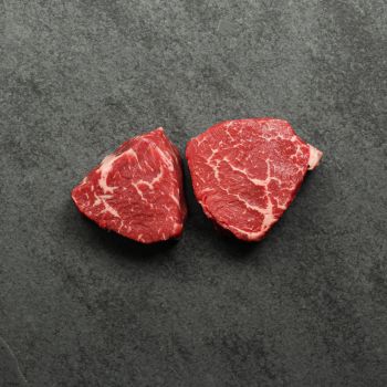 Overhead image of two, 6 oz baseball medallions cut from AAA Canadian beef.