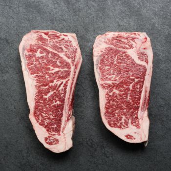 Overhead of Prime Beef New York Bone-In Steak