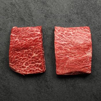 overhead view of two, heavily marbled wagyu flat iron steaks