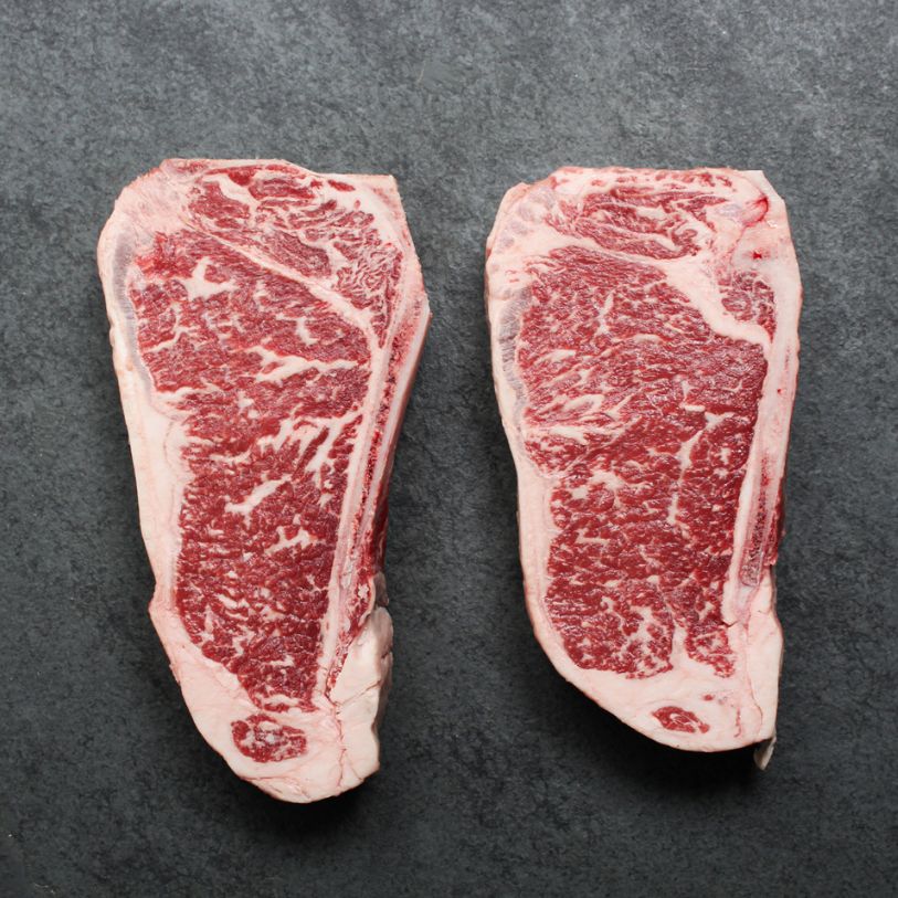 Overhead of Prime Beef New York Bone-In Steak