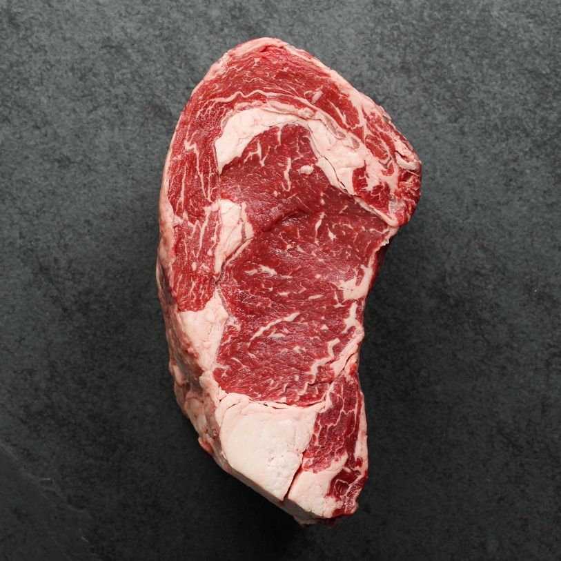 overhead view of the side of a raw boneless ribeye roast