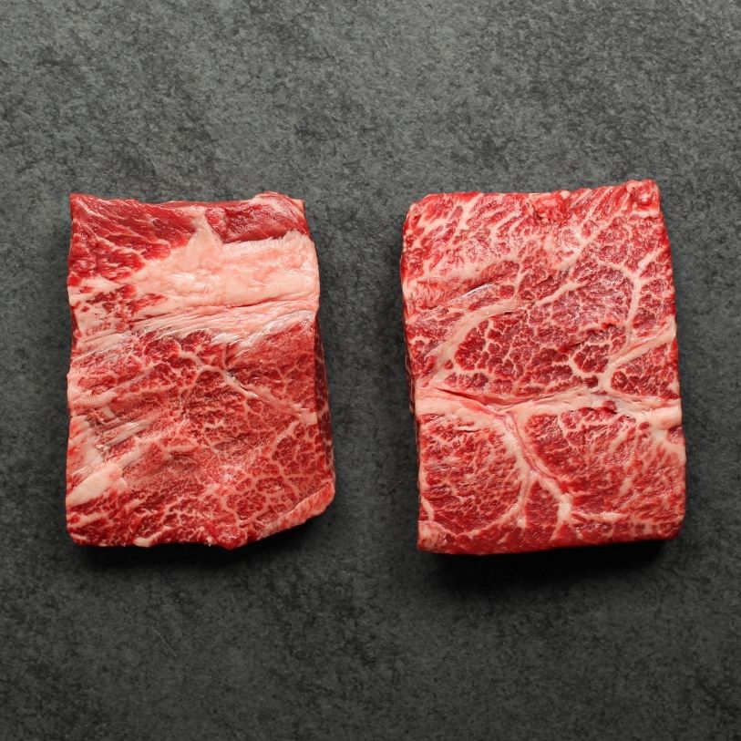 overhead view of two, heavily marbled wagyu flat iron steaks