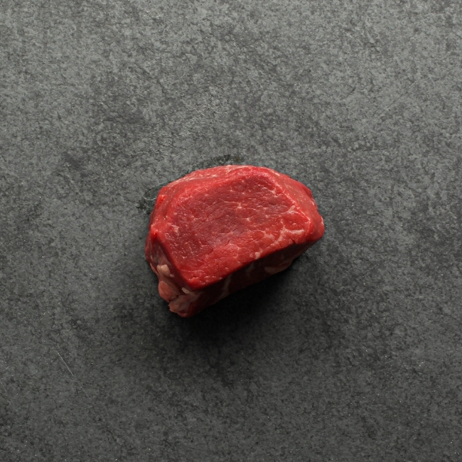 overhead view of a raw, Canadian Prime 4 oz filet mignon steak