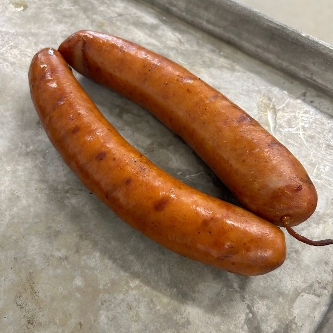 two cooked debreziner sausages