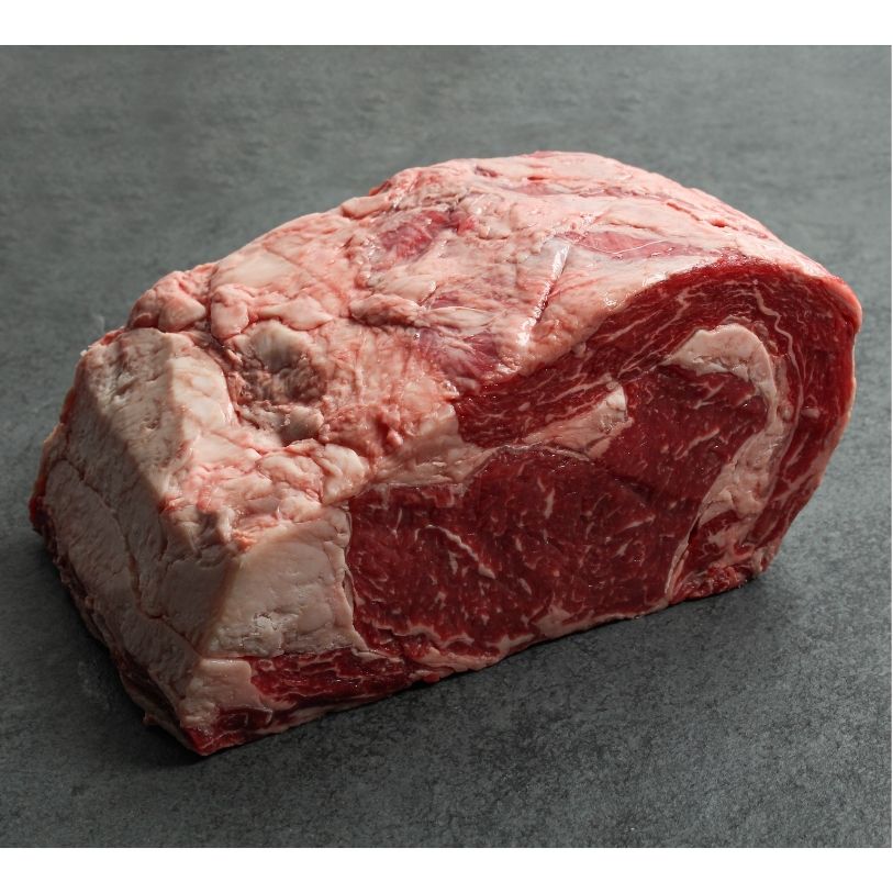 angled view of a raw boneless ribeye roast