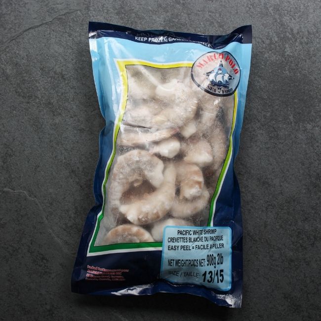 overhead view of a 2 lb bag of raw, frozen jumbo shrimp