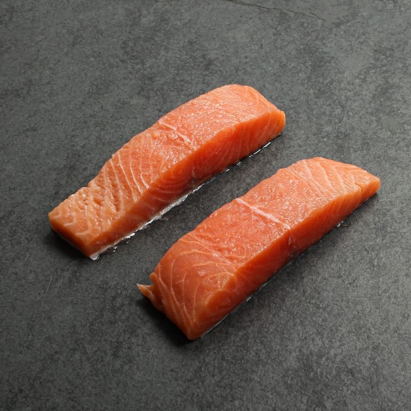 angled view of two raw salmon filets