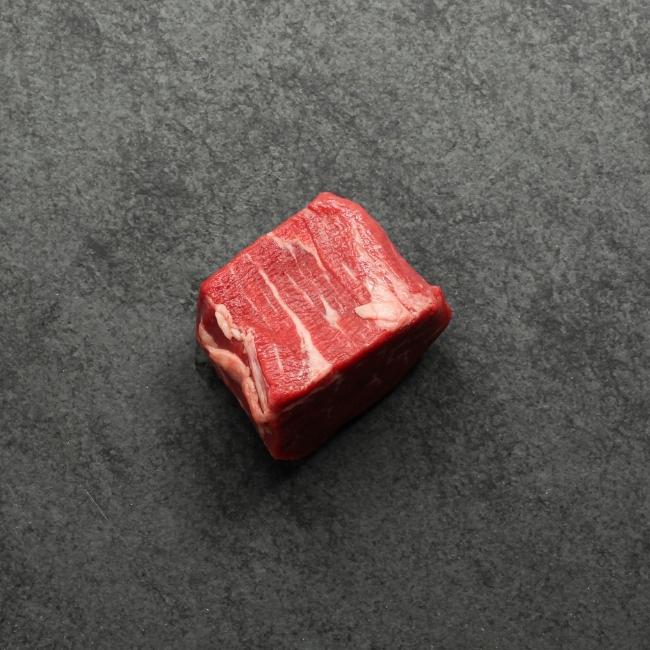 overhead view of the side of a raw, Canadian Prime 4 oz filet mignon steak