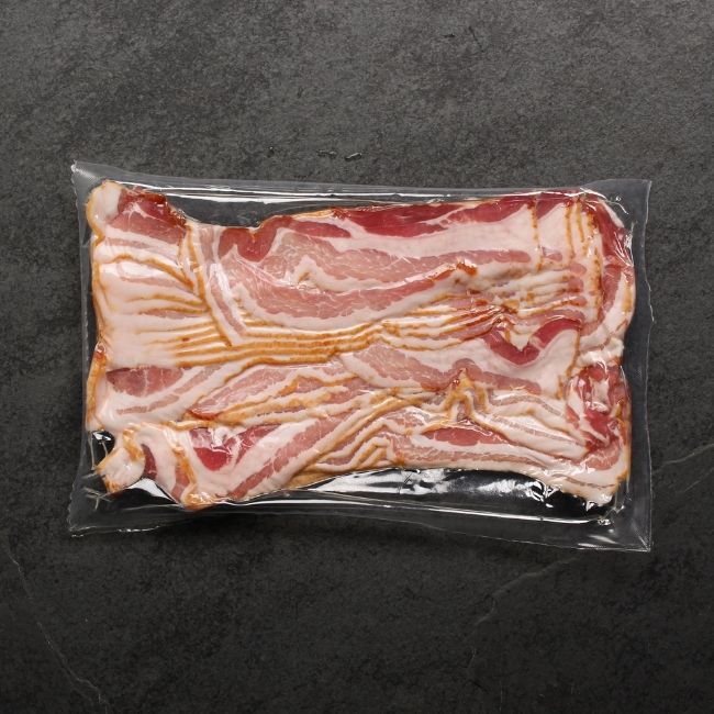 overhead view of raw, sliced bacon from Metzger's Meats  in vacuum package