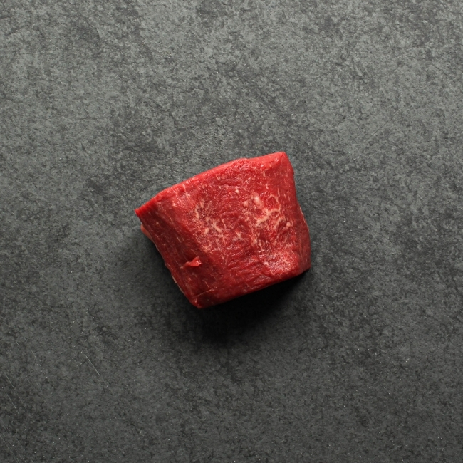 overhead view of the side of a raw, Canadian Prime 4 oz filet mignon steak