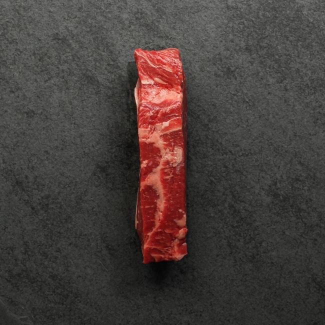 overhead view of the side of a raw grass fed new york steak