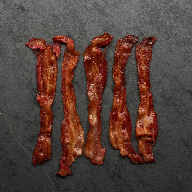 overhead view of cooked, crispy, sliced bacon