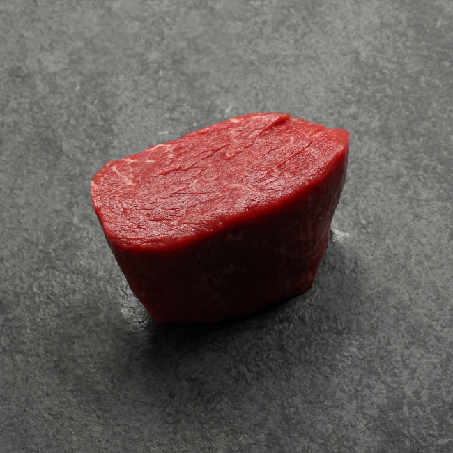 overhead shot of a raw 4 oz aaa beef filet mignon steak