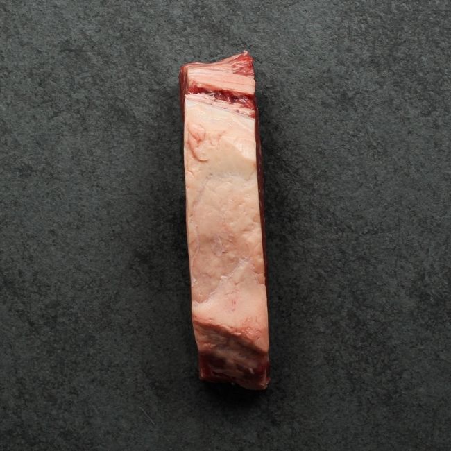 overhead view of the side of a raw grass fed new york steak